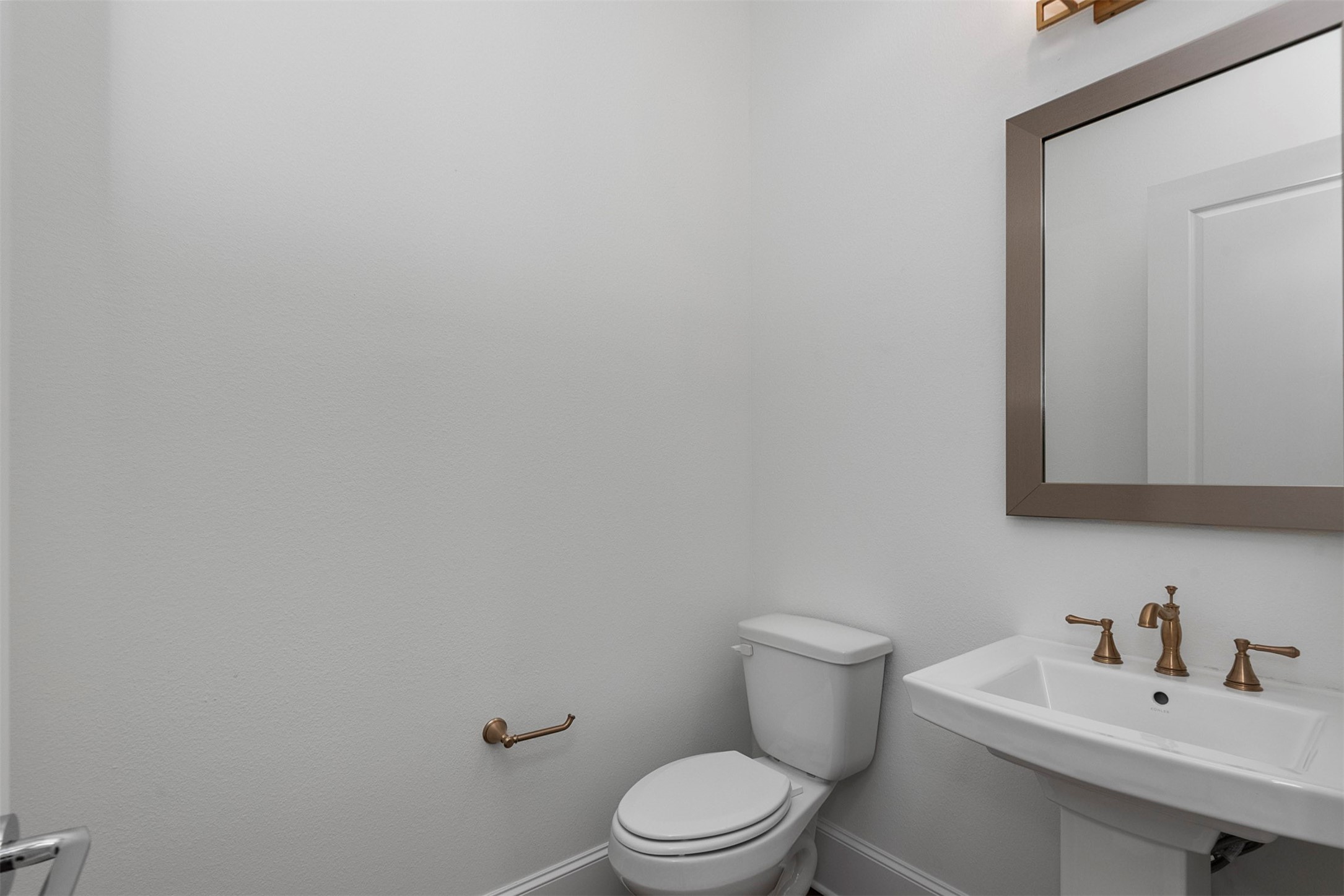 630 Lonestar Road Huntsville, TX 77340 - Photo 27 of 48 Powder bath has elegant pedestal sink, fixtures and lighting.