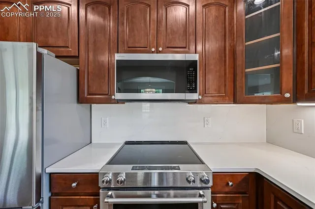 a close view of a stove top oven and sitting space
