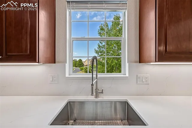 a kitchen sink with a window