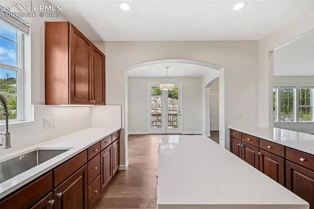 a kitchen with stainless steel appliances a sink and cabinets