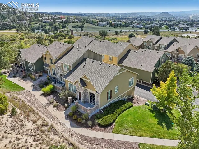 an aerial view of a house with a garden