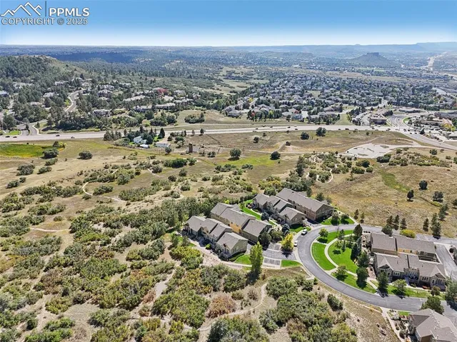 an aerial view of residential houses with outdoor space