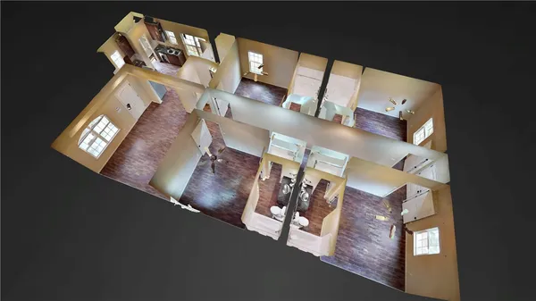 an aerial view of a fireplace and dining room with wooden floor