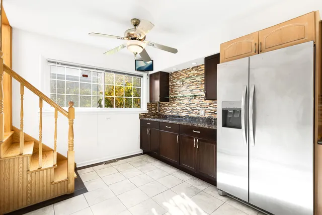 a kitchen with stainless steel appliances a refrigerator and a stove