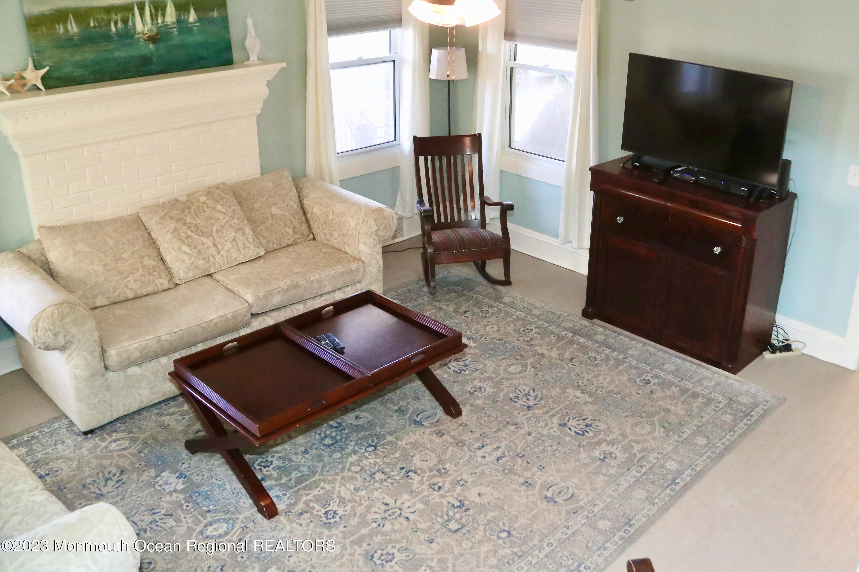 38 Ocean Pathway Ocean Grove, NJ 07756 - Photo 11 of 32 a living room with furniture and a flat screen tv