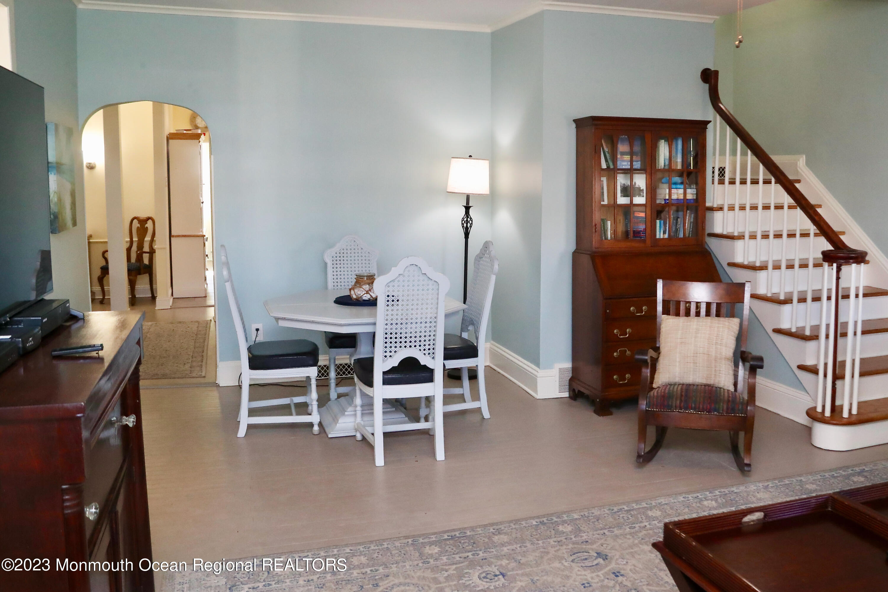 38 Ocean Pathway Ocean Grove, NJ 07756 - Photo 12 of 32 a dining room with furniture and a chandelier