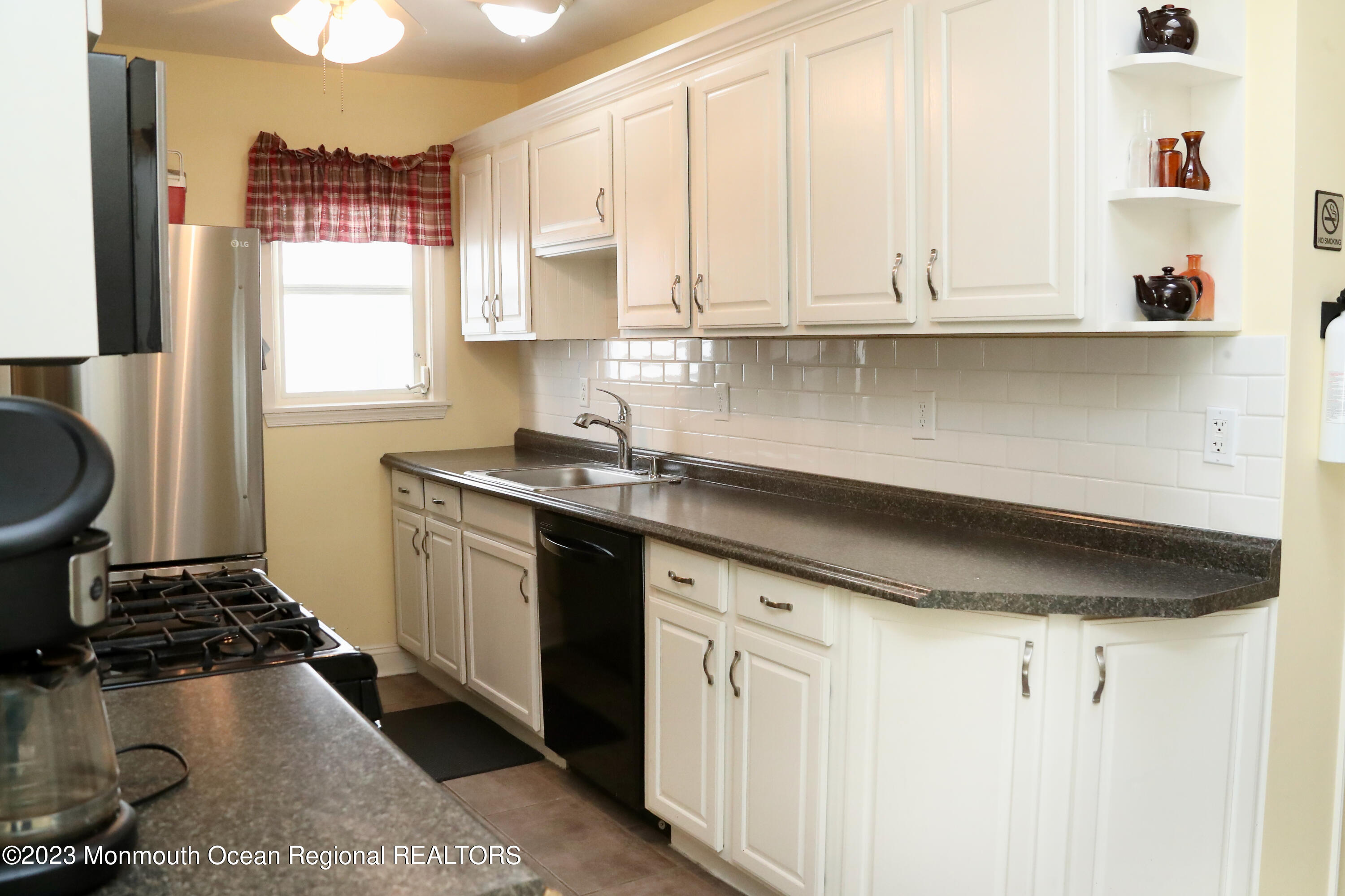38 Ocean Pathway Ocean Grove, NJ 07756 - Photo 16 of 32 a kitchen with sink and cabinets