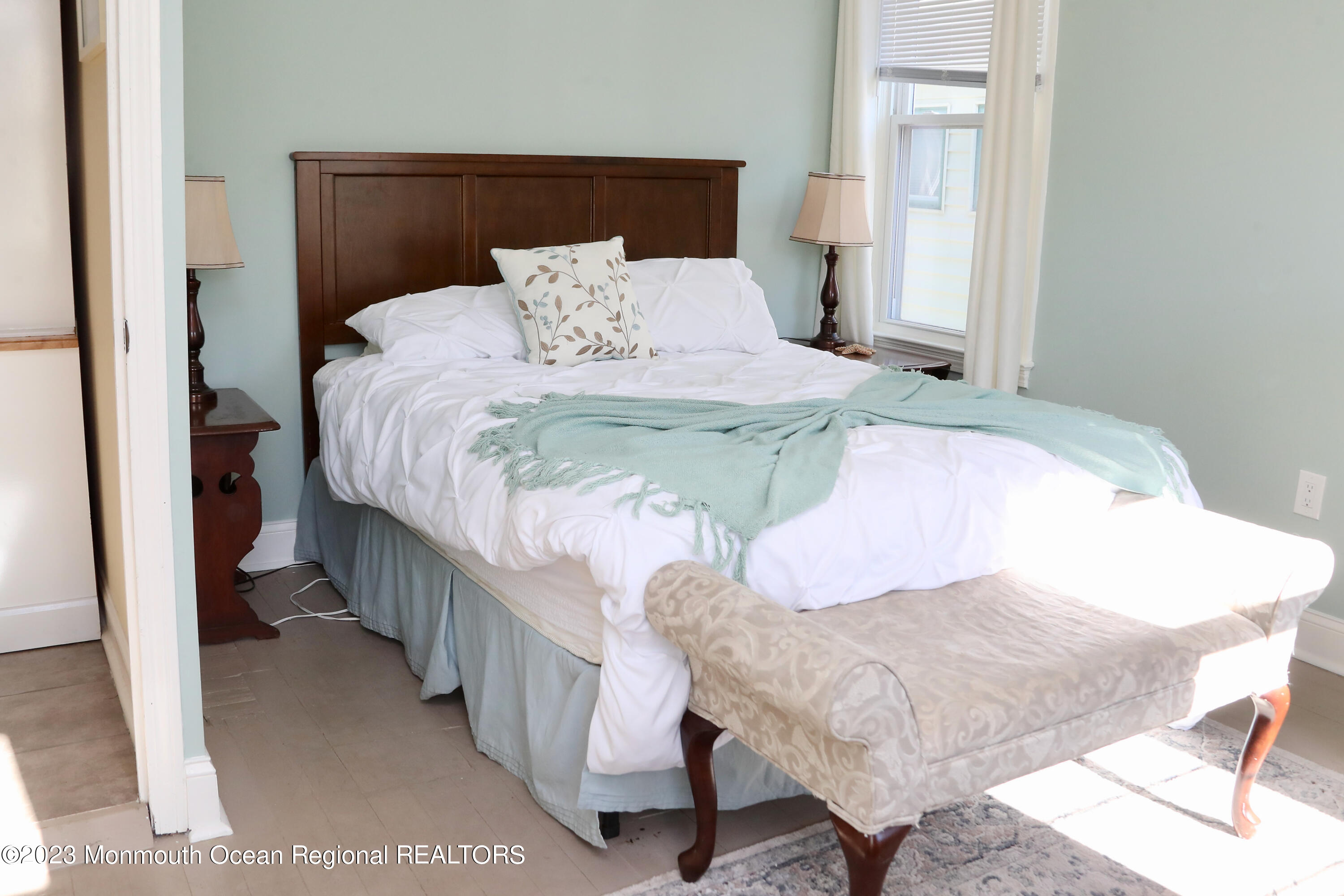 38 Ocean Pathway Ocean Grove, NJ 07756 - Photo 18 of 32 a bedroom with a bed and a night stand
