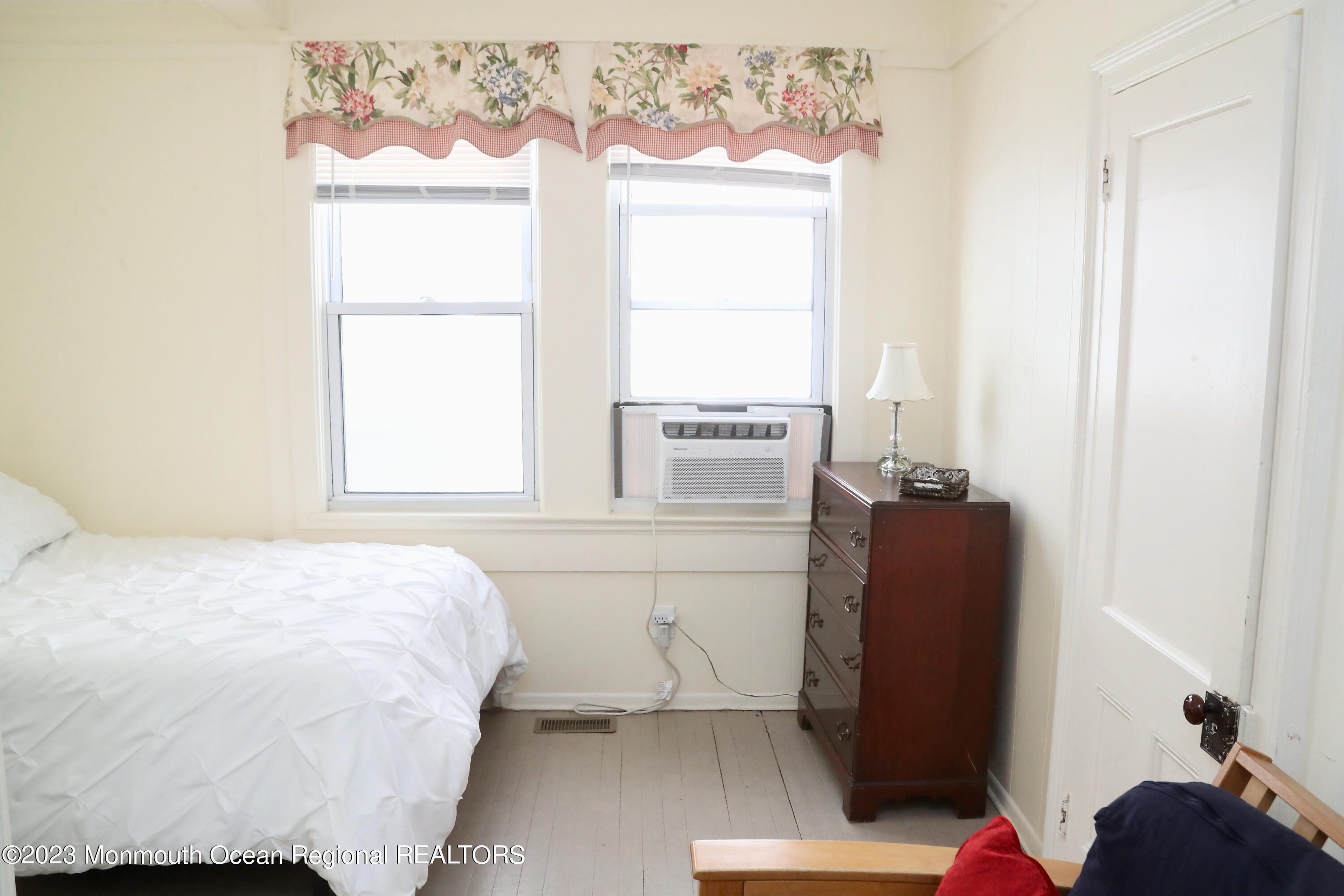 38 Ocean Pathway Ocean Grove, NJ 07756 - Photo 19 of 32 a bedroom with a bed and a window with wooden floor