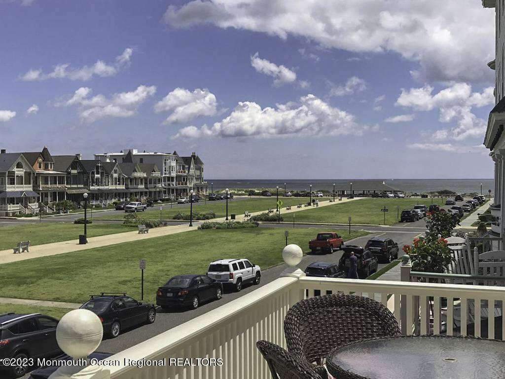 38 Ocean Pathway Ocean Grove, NJ 07756 - Photo 4 of 32 a view of a swimming pool and a chairs in a patio