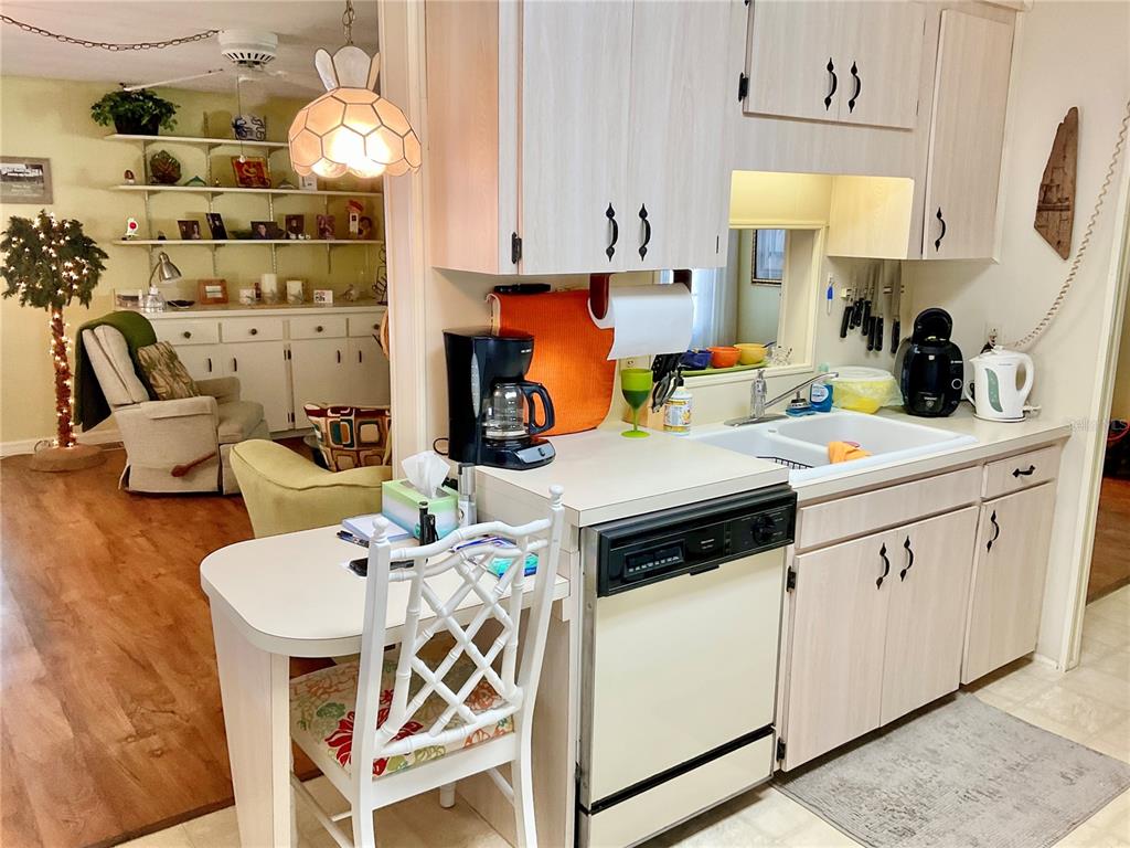 1100 South Belcher Road, Unit 100 Largo, FL 33771 - Photo 13 of 56 a kitchen that has a cabinets and a stove