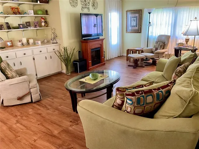 a bedroom with a bed a dresser and a large mirror