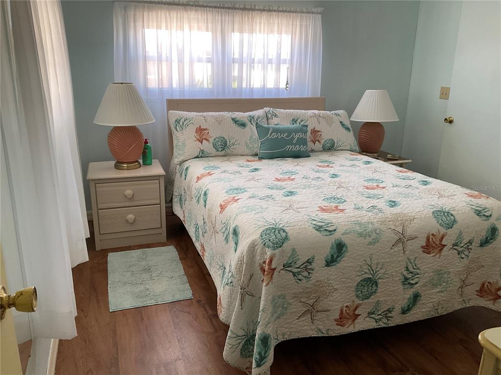 1100 South Belcher Road, Unit 100 Largo, FL 33771 - Photo 18 of 56 a bedroom with a bed and a window