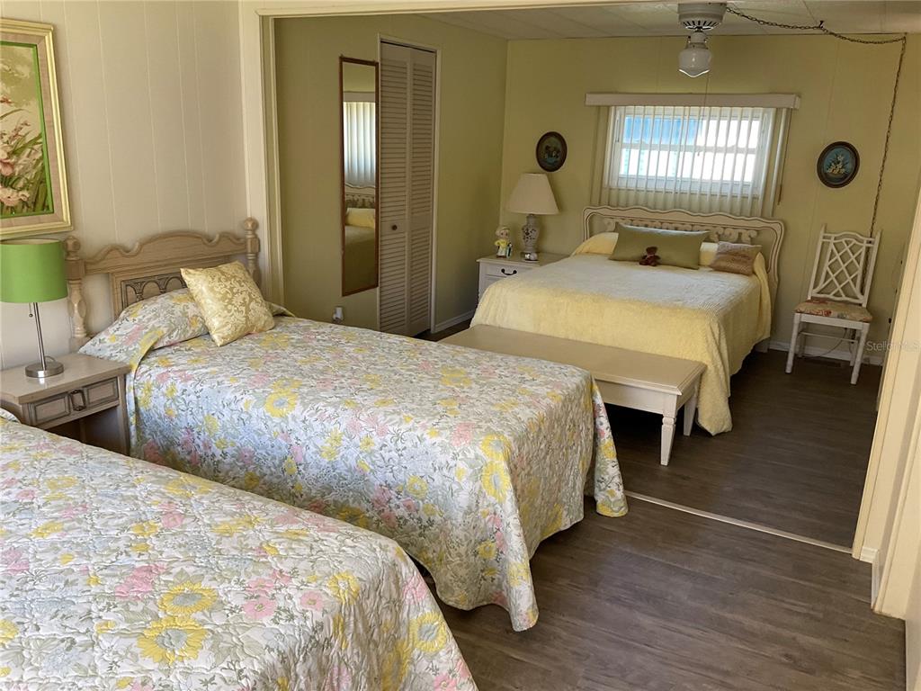 1100 South Belcher Road, Unit 100 Largo, FL 33771 - Photo 19 of 56 a bedroom with two beds and a dresser