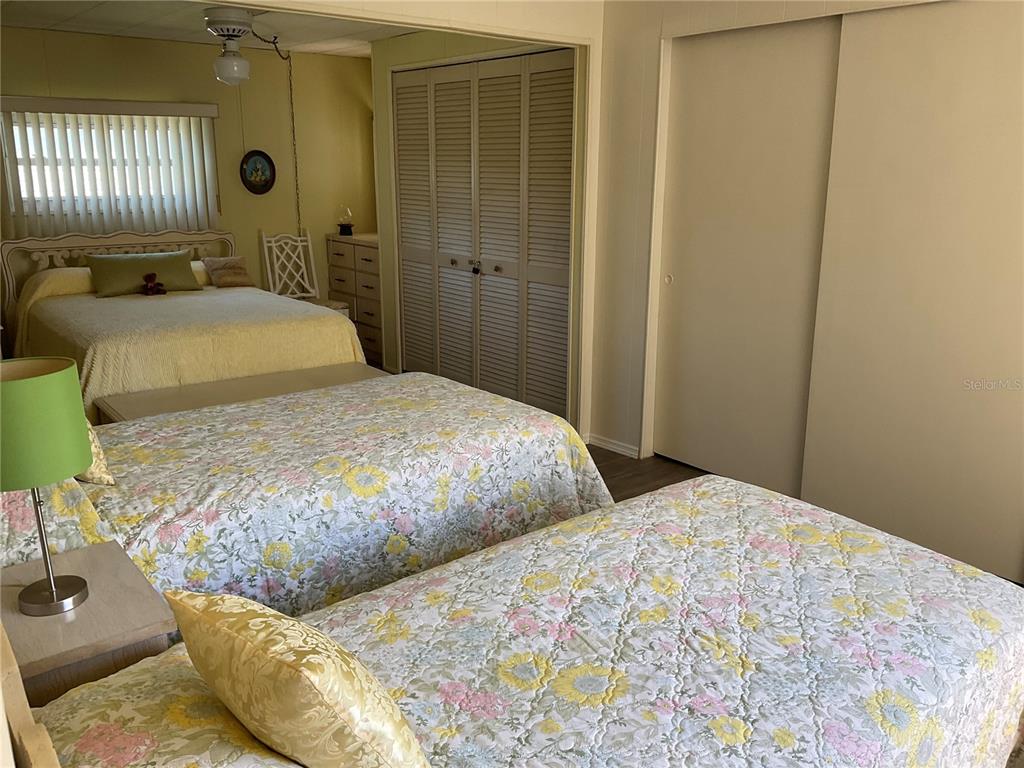 1100 South Belcher Road, Unit 100 Largo, FL 33771 - Photo 20 of 56 a bedroom with two beds and painted walls