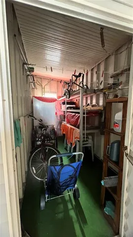 a group of people sitting in front of a building