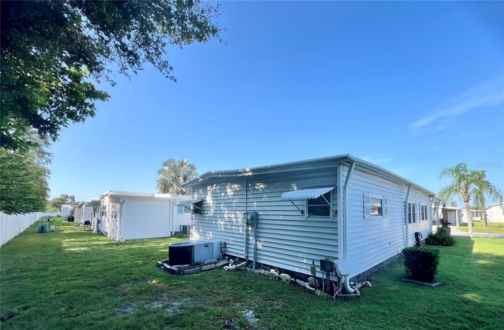 1100 South Belcher Road, Unit 100 Largo, FL 33771 - Photo 25 of 56 a front view of a house with garden