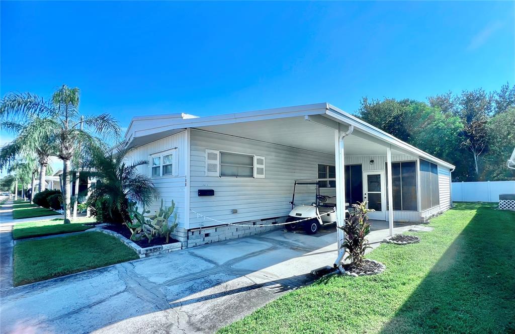 1100 South Belcher Road, Unit 100 Largo, FL 33771 - Photo 3 of 56 a house view with a garden space