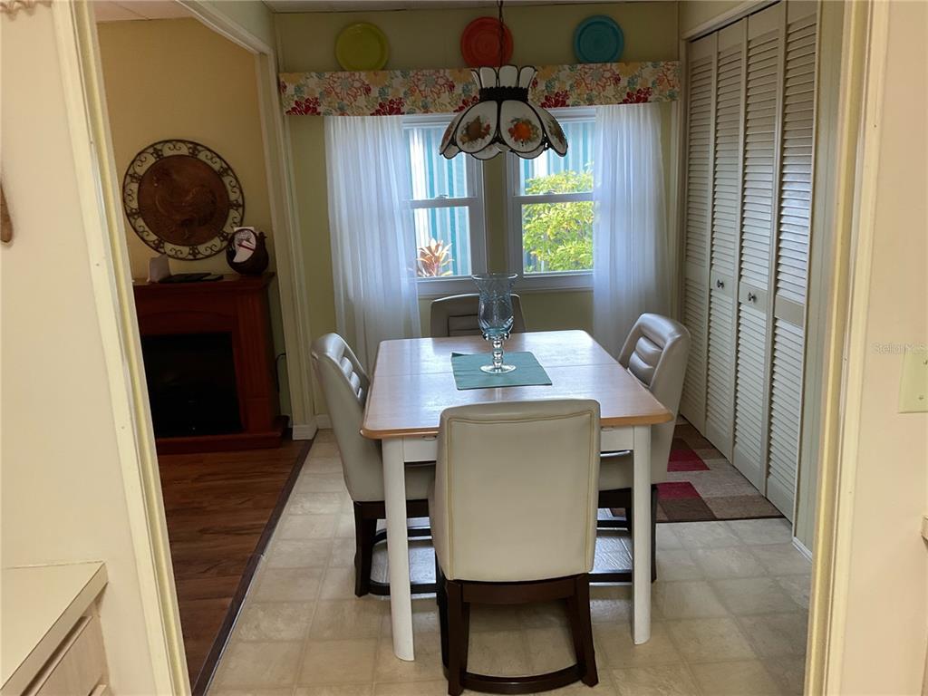 1100 South Belcher Road, Unit 100 Largo, FL 33771 - Photo 7 of 56 a dining room with furniture and window