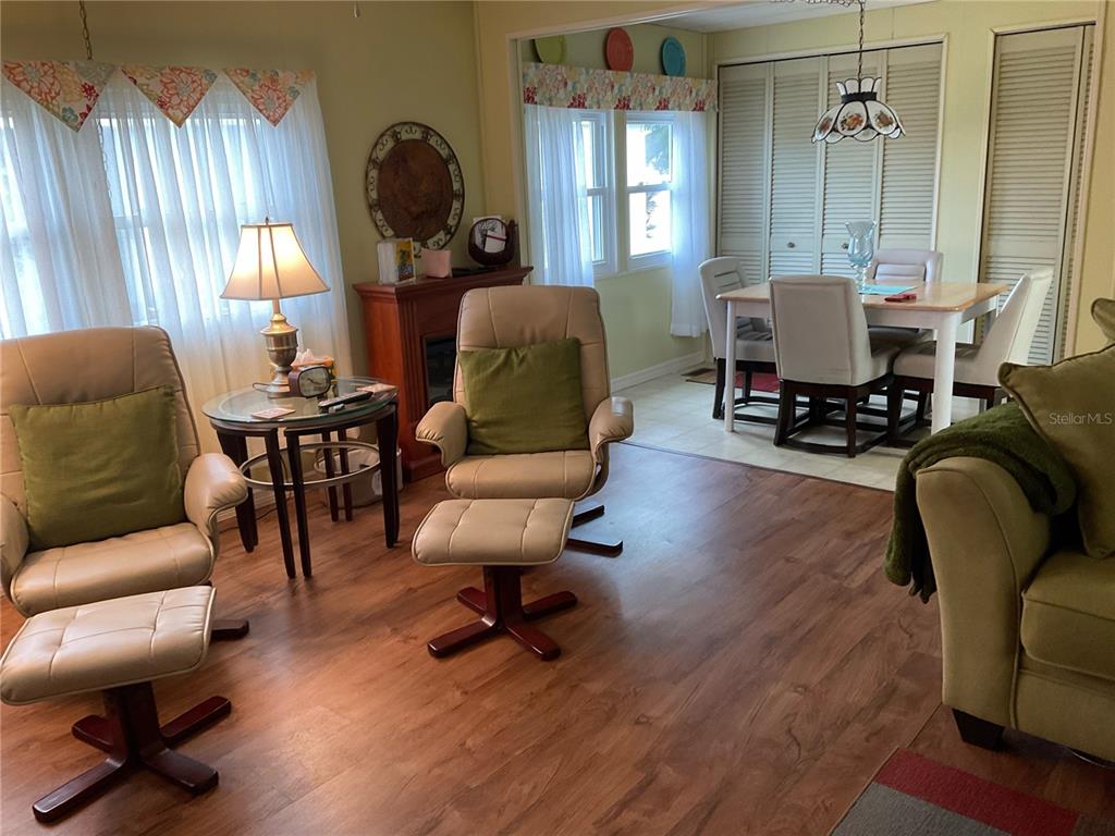 1100 South Belcher Road, Unit 100 Largo, FL 33771 - Photo 9 of 56 a living room filled with furniture and a window