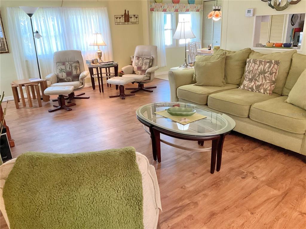 1100 South Belcher Road, Unit 100 Largo, FL 33771 - Photo 10 of 56 a living room with furniture and a large window