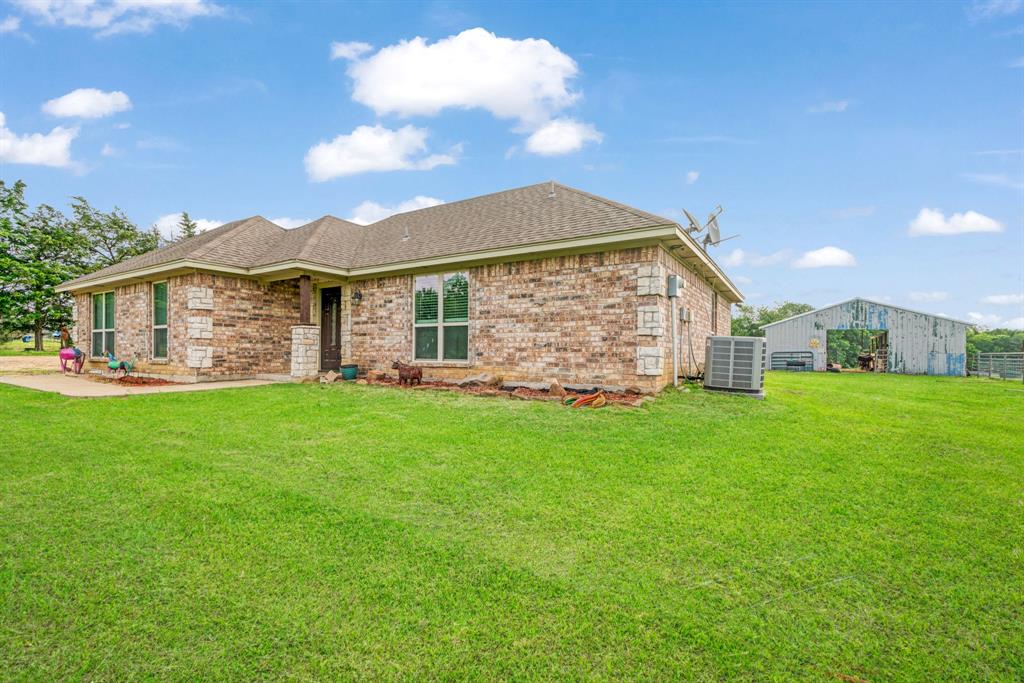 1890 County Road Sumner, TX 75486 - Photo 3 of 20 a view of a house with a yard