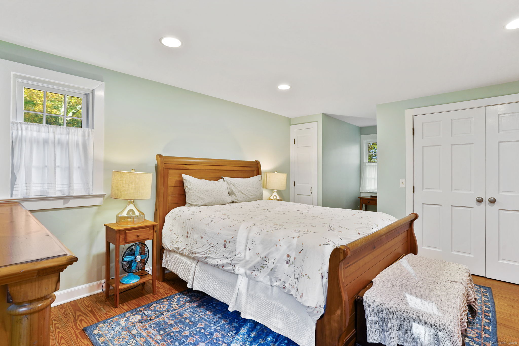 477 Newtown Turnpike Redding, CT 06896 - Photo 23 of 38 a bedroom with a bed and wooden floor