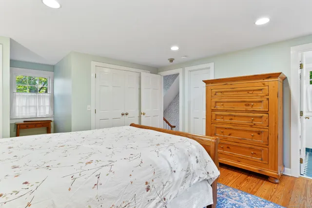 a bedroom with a bed and a dresser