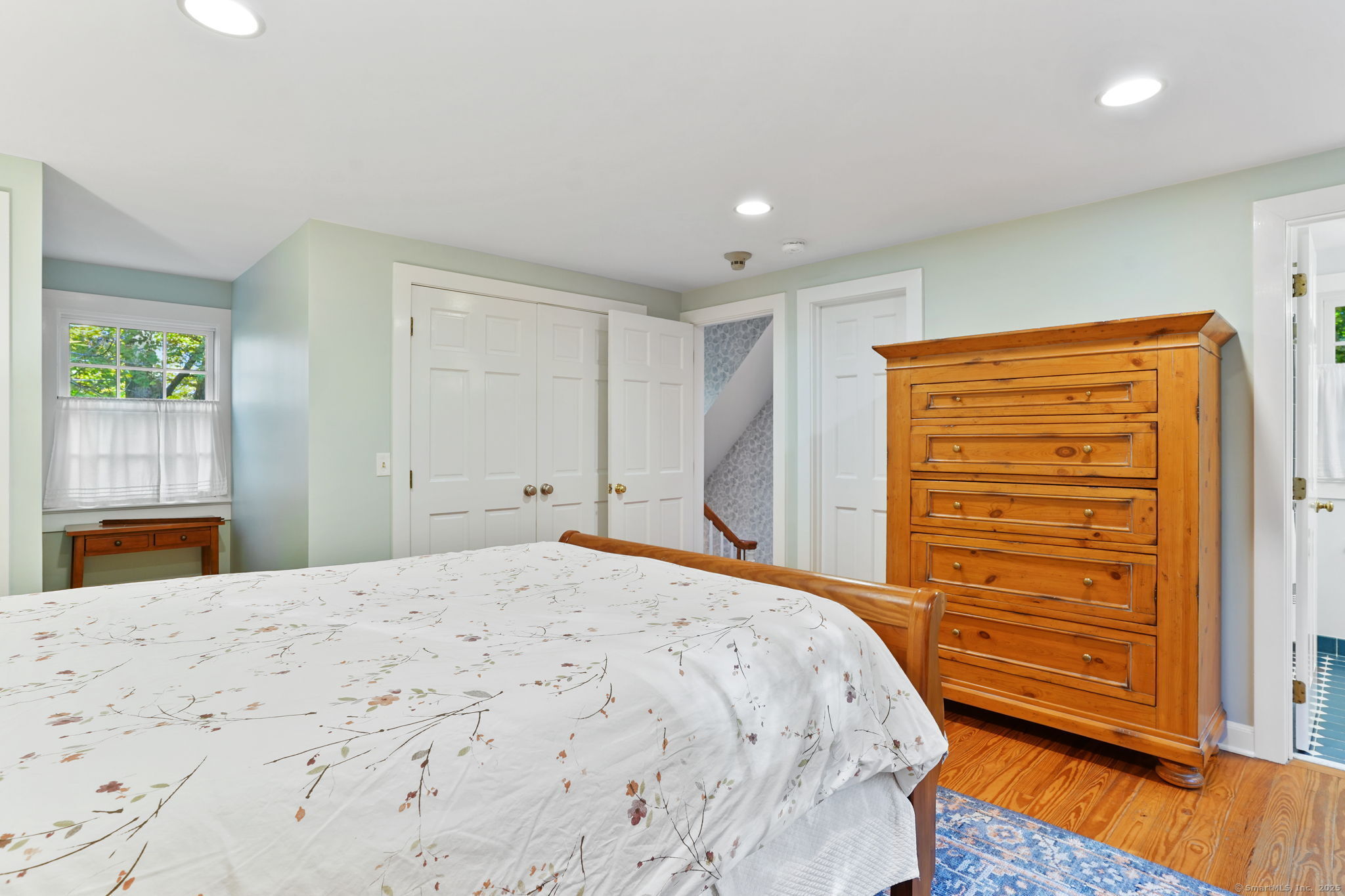 477 Newtown Turnpike Redding, CT 06896 - Photo 24 of 38 a bedroom with a bed and a dresser