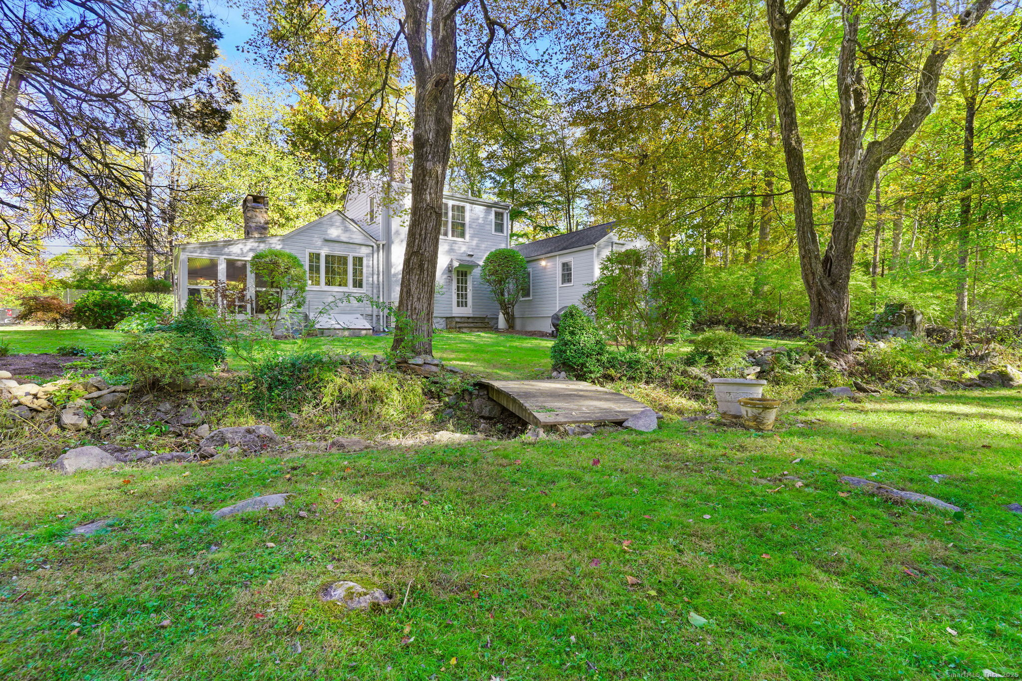 477 Newtown Turnpike Redding, CT 06896 - Photo 27 of 38 a view of a house with a backyard