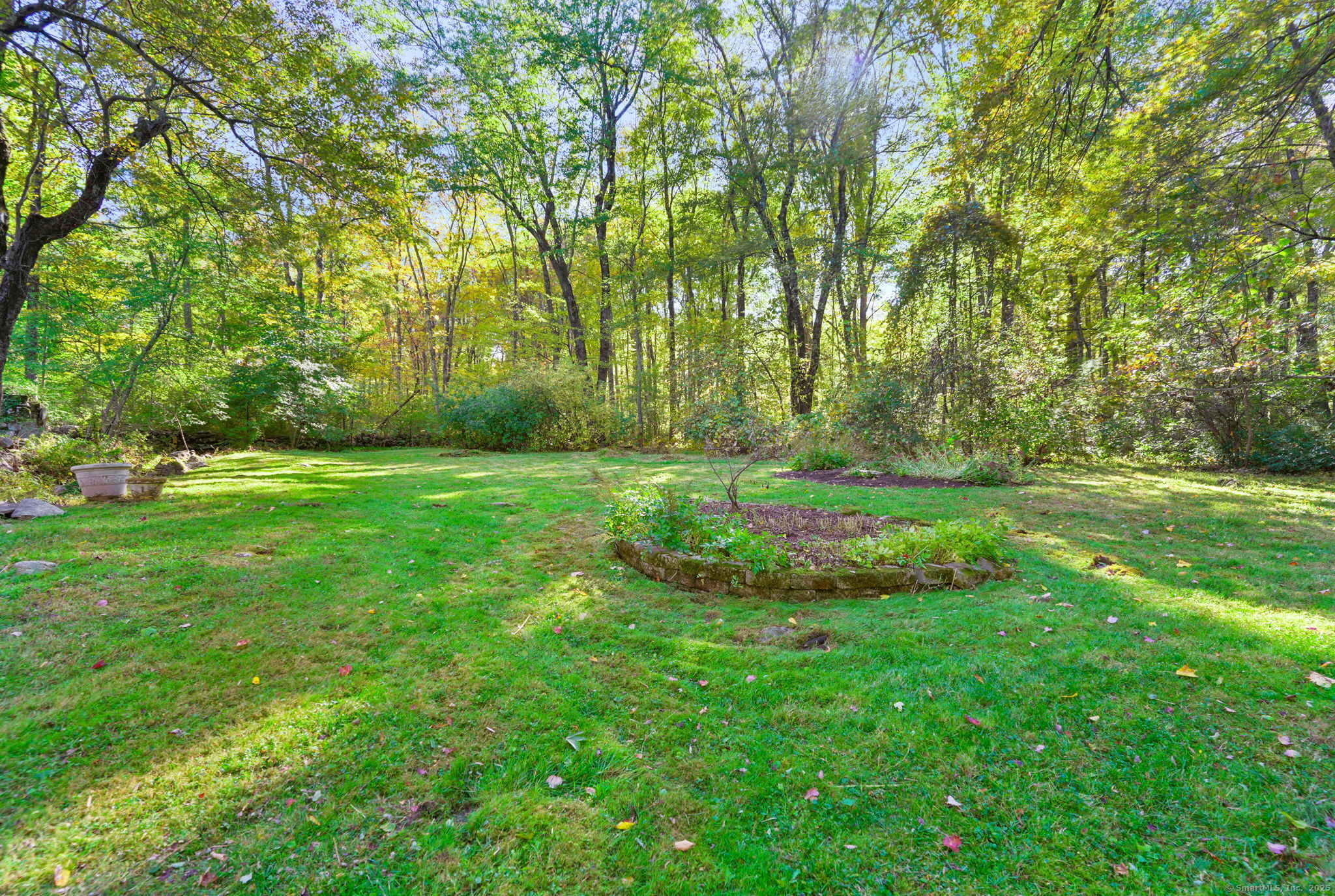 477 Newtown Turnpike Redding, CT 06896 - Photo 28 of 38 a view of a grassy field with trees