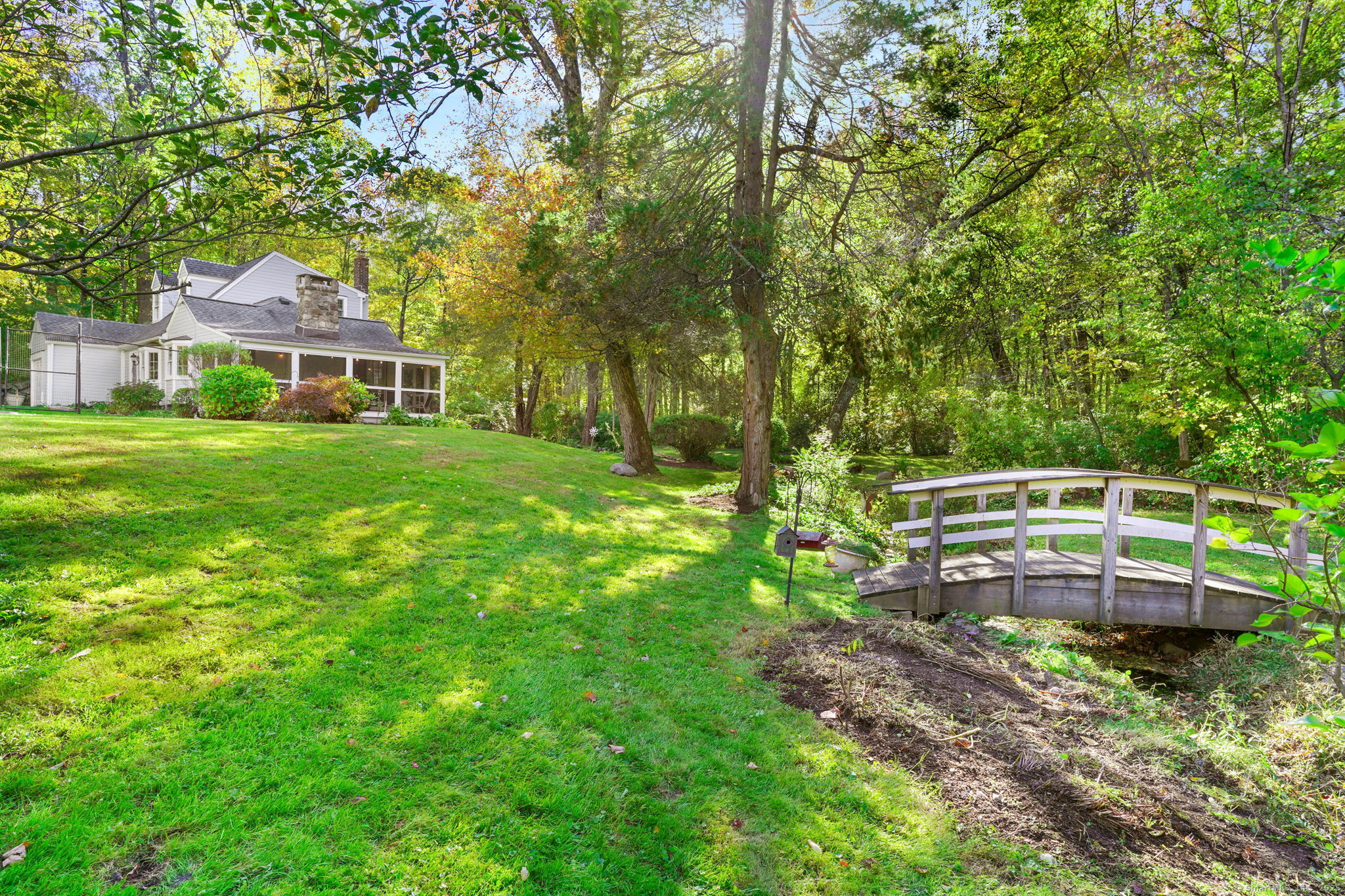 477 Newtown Turnpike Redding, CT 06896 - Photo 31 of 38 a backyard of a house with seating space