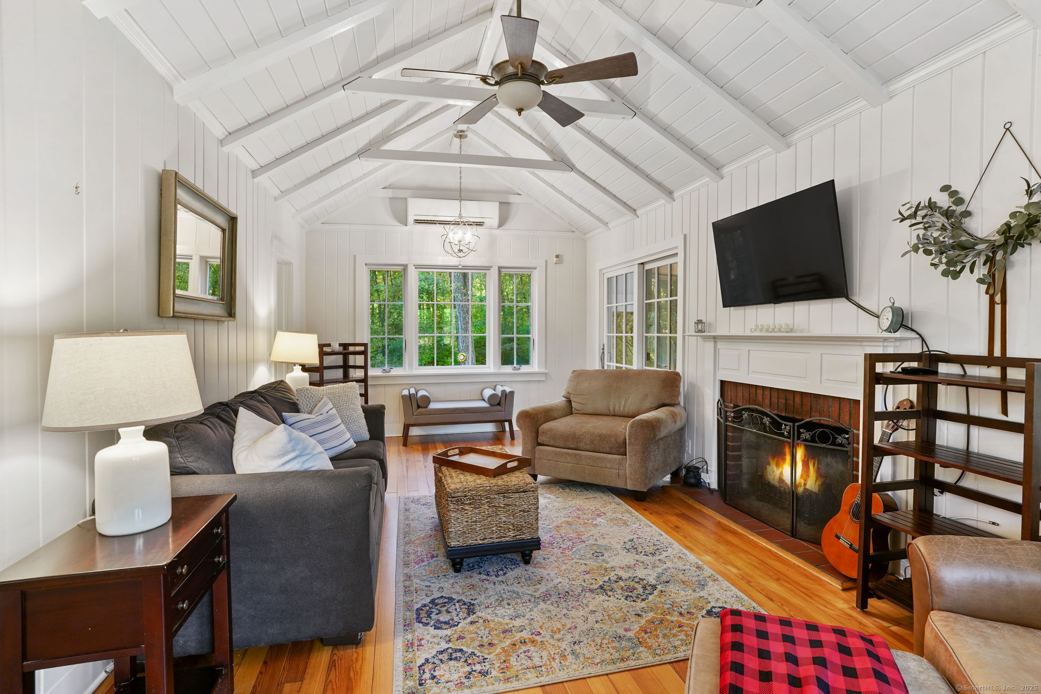 477 Newtown Turnpike Redding, CT 06896 - Photo 6 of 38 a living room with furniture fireplace and flat screen tv