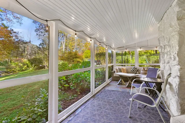 a work room with large glass windows and table