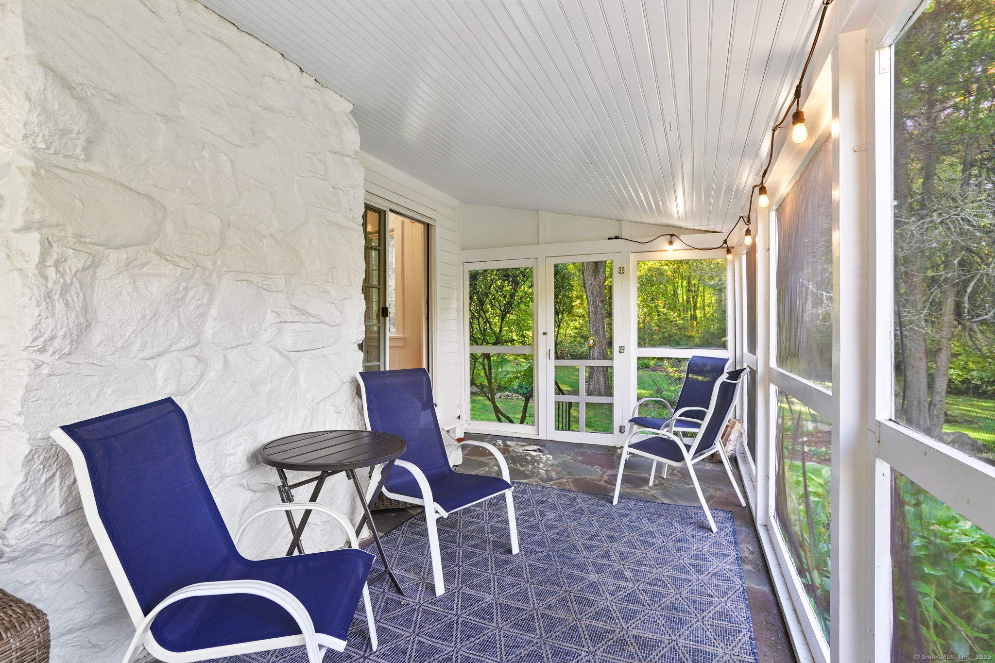 477 Newtown Turnpike Redding, CT 06896 - Photo 8 of 38 a balcony with table and chairs