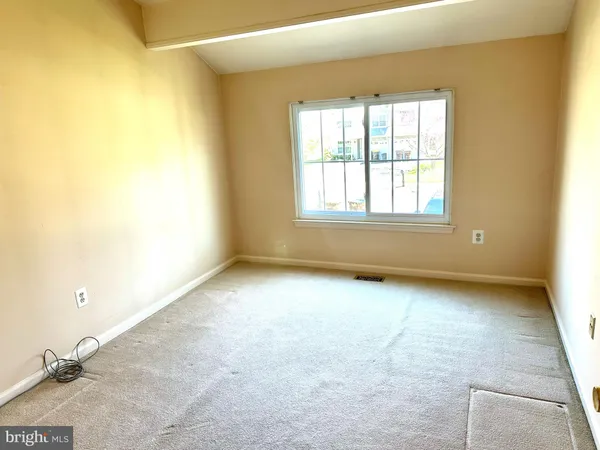 a view of a room with a large window