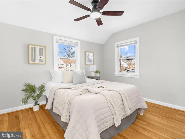 a bed room with a bed and a chandelier