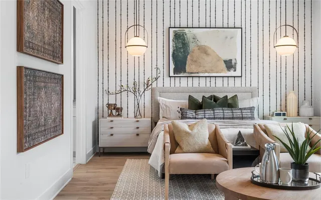 a bathroom with a granite countertop sink a mirror and shower