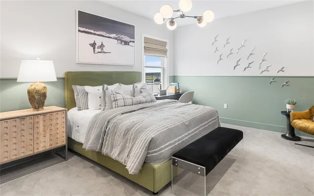 a front view of a house with a garden and plants