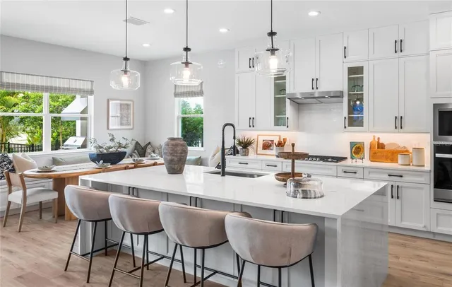 a kitchen with counter top space and sink