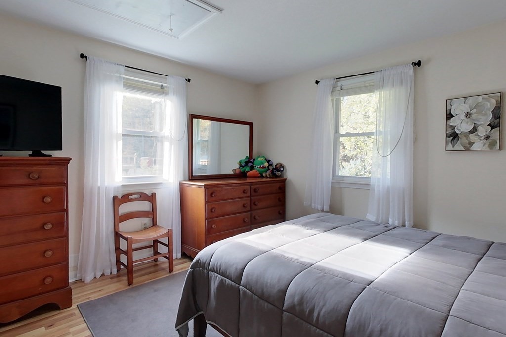 114 Walker Road Shirley, MA 01464 - Photo 12 of 34 a bedroom with a bed and a flat screen television