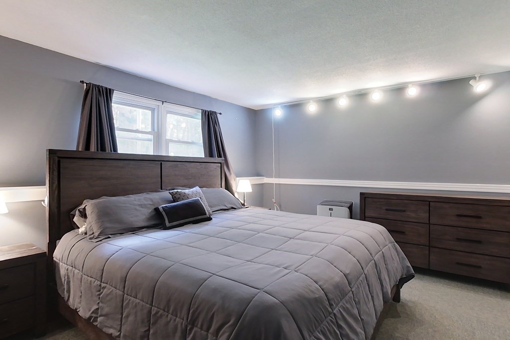 114 Walker Road Shirley, MA 01464 - Photo 17 of 34 a bedroom with a bed and a window