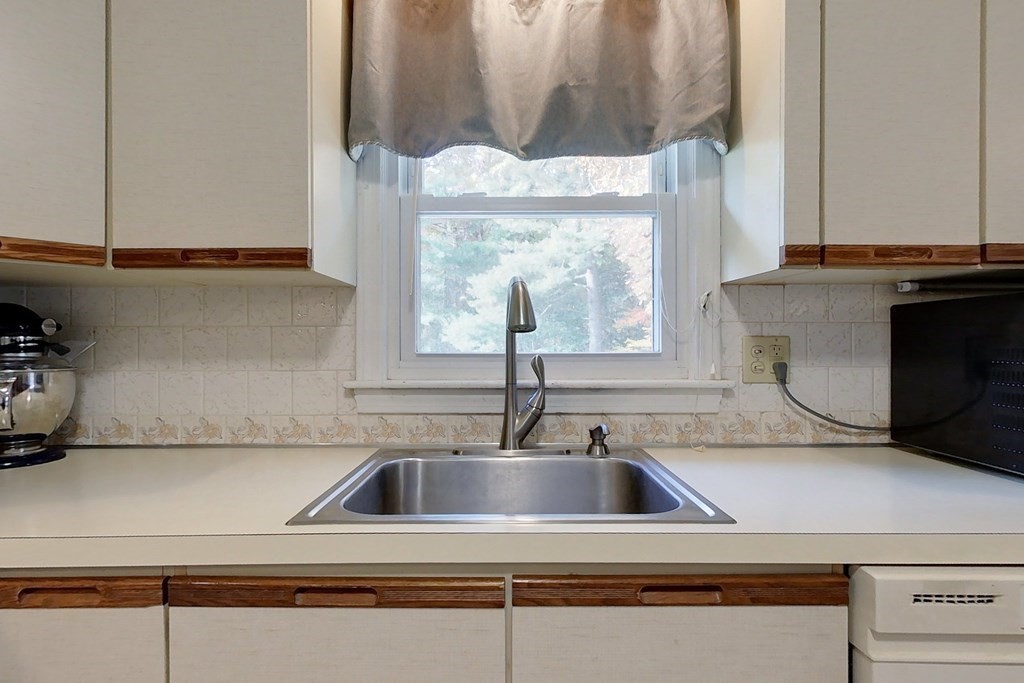 114 Walker Road Shirley, MA 01464 - Photo 3 of 34 a kitchen with a sink and a window