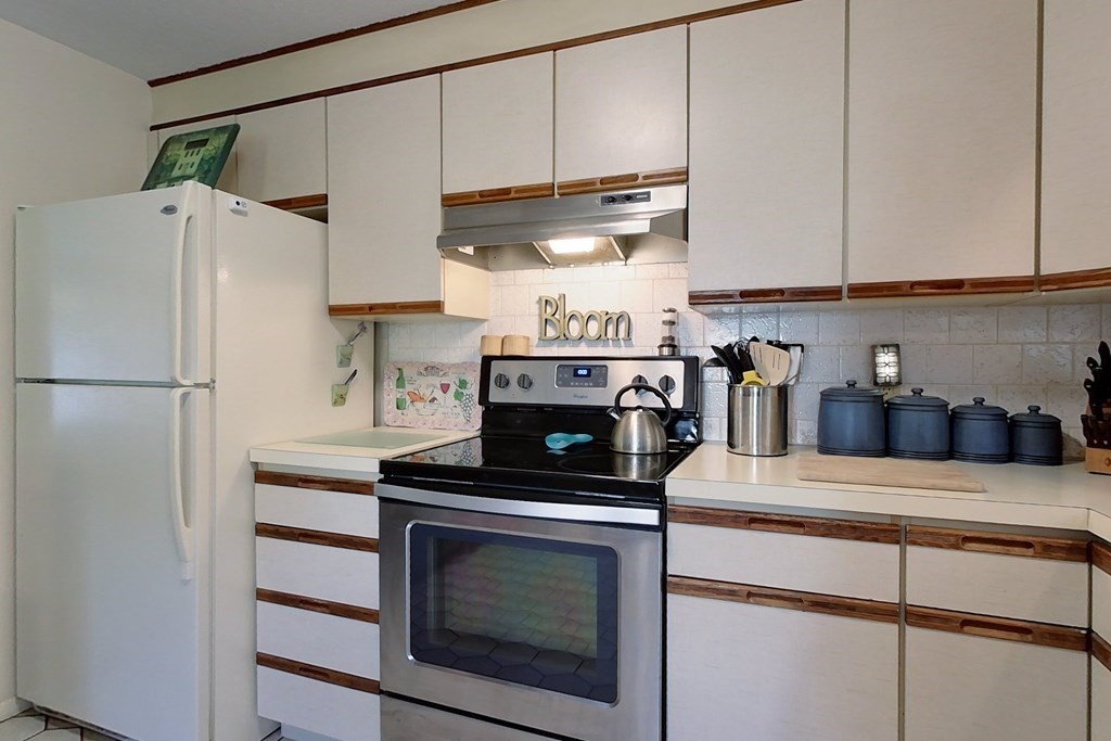 114 Walker Road Shirley, MA 01464 - Photo 4 of 34 a kitchen with stainless steel appliances granite countertop a refrigerator sink and stove