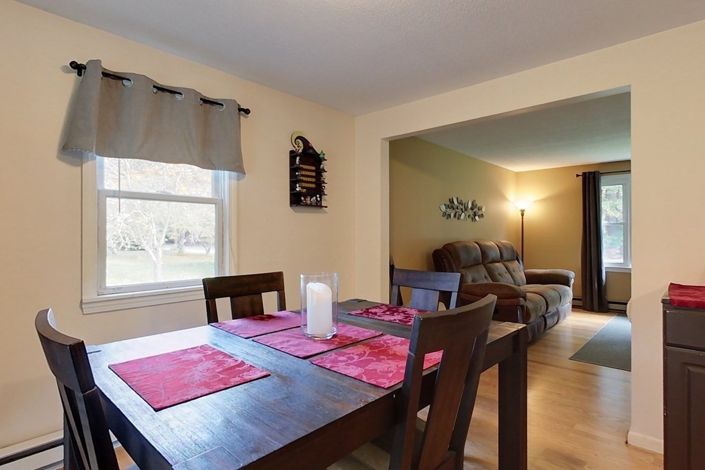 114 Walker Road Shirley, MA 01464 - Photo 8 of 34 a view of a dining room with furniture and wooden floor