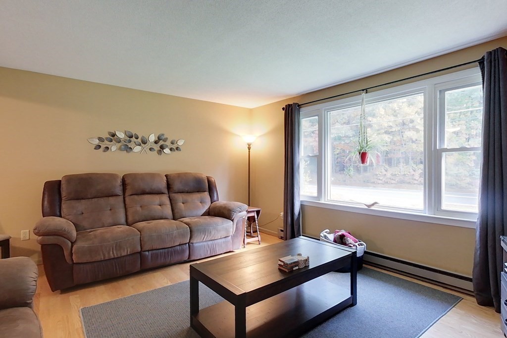 114 Walker Road Shirley, MA 01464 - Photo 9 of 34 a living room with furniture and a large window