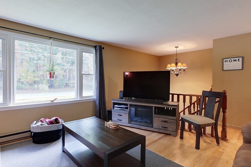 114 Walker Road Shirley, MA 01464 - Photo 10 of 34 a living room with furniture and a flat screen tv