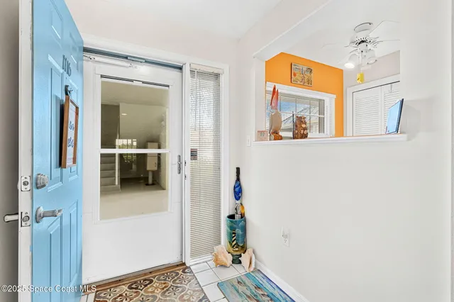 a view of a hallway view with furniture and wooden floor