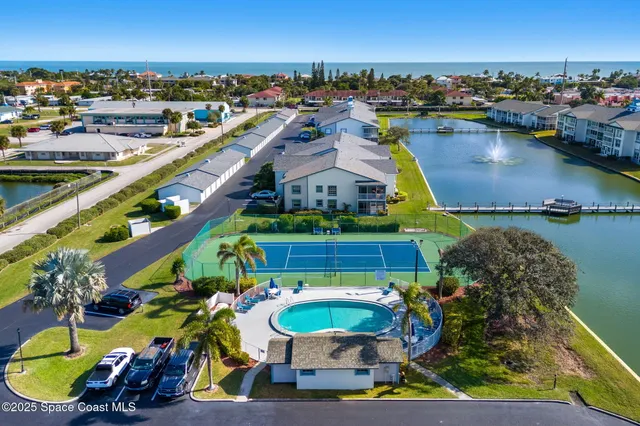 an aerial view of a house with a lake view