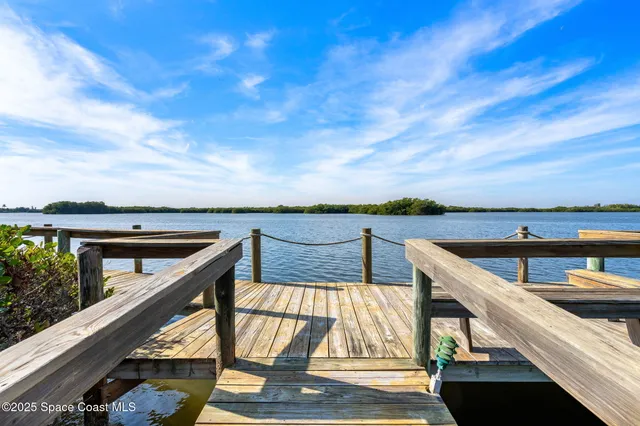a view of swimming pool with seating area